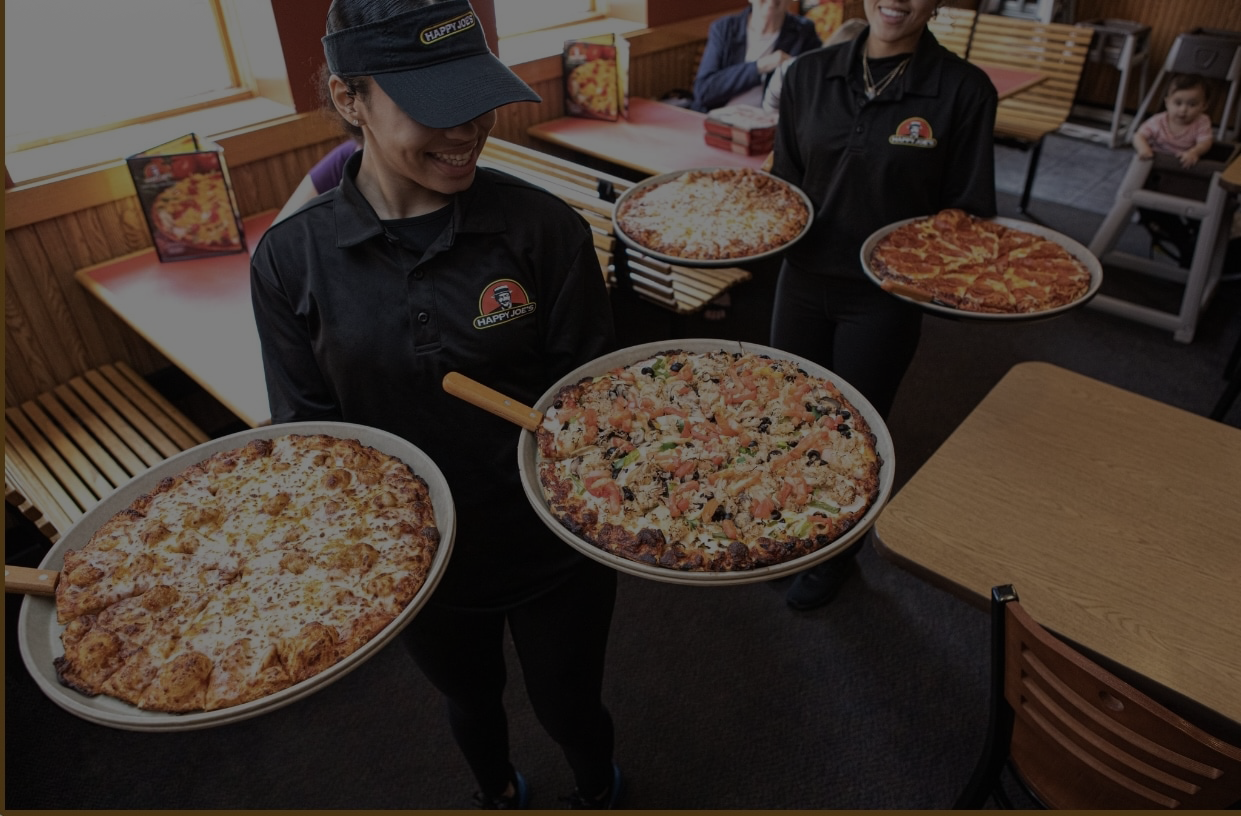 Serving Large Pizzas at Happy Joe's