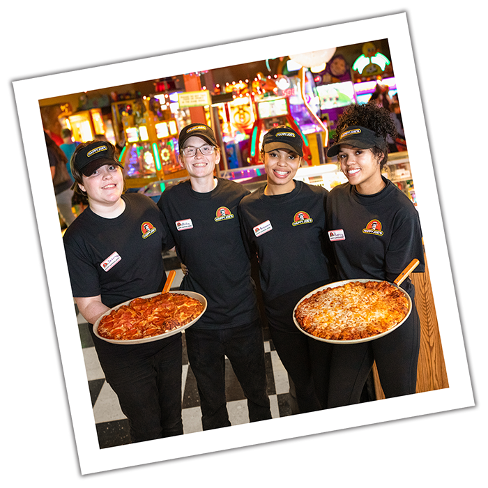 Photograph style image of Happy Joe's team servers holding pizzas.