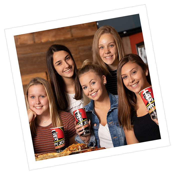 Photograph style image of girls holding Happy Joe's cups.